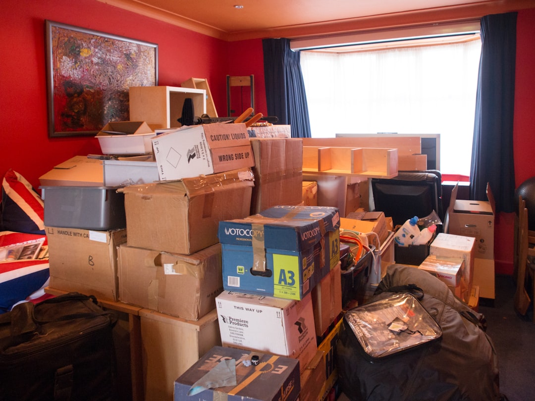 Brown cardboard boxes on brown wooden table — Photo by Brett Jordan on Unsplash